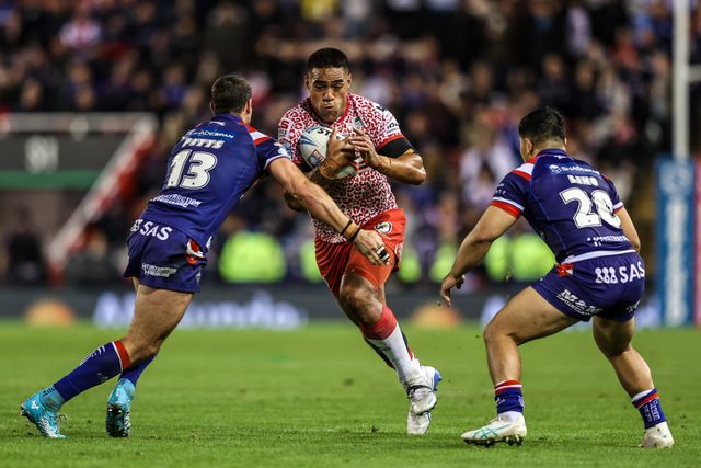 Joe Ofahengaue of Leigh Leapords is tackled by Jay Pitts of Wakefield Trinity and Mason Lino of Wakefield Trinity during the Betfred Super League play-off Eliminator 1 match Leigh Leopards vs Wakefield Trinity at Progress With Unity Stadium, Leigh, United Kingdom, 26th September 2025

(Photo by Alfie Cosgrove/News Images)