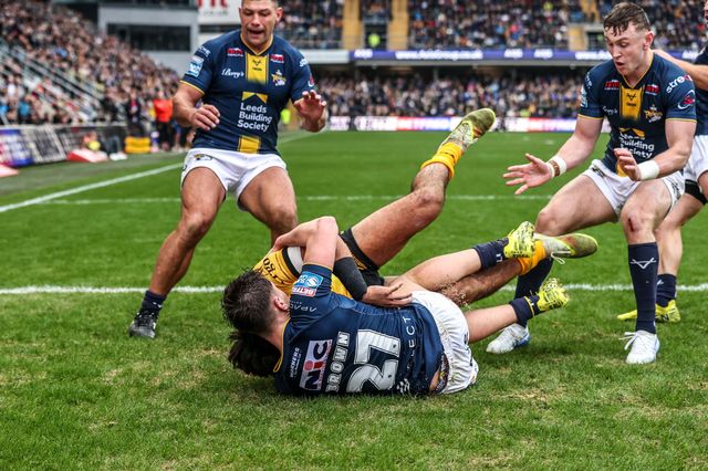 Krystian Mapapalangi of Castleford Tigers is tackled by George Brown of Leeds Rhinos during the Betfred Super League round 4 match Leeds Rhinos vs Castleford Tigers at AMT Headingley Stadium, Leeds, United Kingdom on 08 March 2026

(Photo by Alfie Cosgrove/News Images)