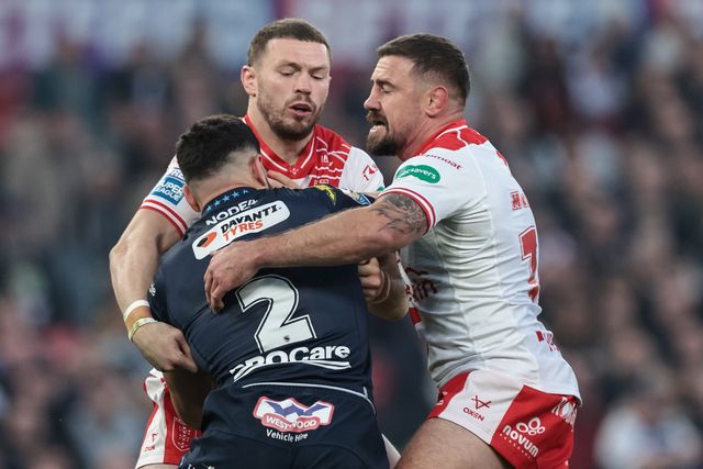 Abbas Miski of Wigan Warriors is tackled by James Batchelor of Hull KR and Michael McIlorum of Hull KR during the 2025 Betfred Super League Grand Final Hull KR v Wigan Warriors at Old Trafford, Manchester, United Kingdom, 11th October 2025

(Photo by Mark Cosgrove/News Images)