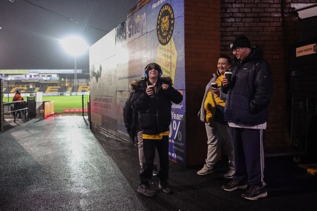 Castleford fans grab a warm drink on a cold wet night under the lights during the Betfred Super League Round 3 match Castleford Tigers vs Huddersfield Giants at OneBore Stadium, Castleford, Untied Kingdom on 27 February 2026

(Photo by Mark Cosgrove/News Images)