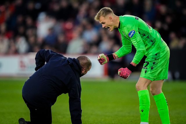 Blackburn Rovers goalkeeper Balazs Toth reacts after a fan invades the pitch to celebrate Yuki Ohashi of Blackburn Rovers scoring a goal to make it 0-2  during the Sky Bet Championship match Sheffield United vs Blackburn Rovers at Bramall Lane, Sheffield, United Kingdom on 22 April 2026

(Photo by Maynard Manyowa/News Images)