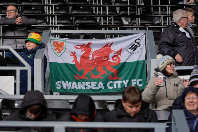 A Wales flag erected by Swansea fans prior to kick off during the Sky Bet Championship match Derby County vs Swansea City at Pride Park Stadium, Derby, United Kingdom on 14 February 2026

(Photo by Maynard Manyowa/News Images)