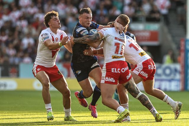 Harry Newman of Leeds Rhinos is tackled during the Betfred Super League round 15 match St Helens vs Leeds Rhinos at Totally Wicked Stadium, St Helens, United Kingdom, 20th June 2025

(Photo by Alfie Cosgrove/News Images)
