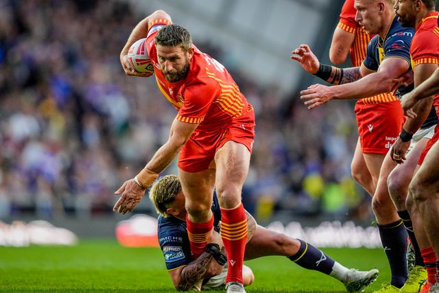 Julian Bousquet of Catalans Dragons is tackled by Danny Levi of Leeds Rhinos during the Betfred Super League round 9 match Leeds Rhinos vs Catalans Dragons at AMT Headingley Stadium, Leeds, United Kingdom on 24 April 2026

(Photo by Maynard Manyowa/News Images)