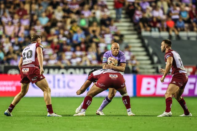 Dean Hadley of Hull KR is tackled during the Betfred Super League round 22 match Wigan Warriors vs Hull KR at The Brick Community Stadium, Wigan, United Kingdom, 15th August 2025

(Photo by Alfie Cosgrove/News Images)