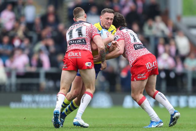 Ben Currie of Warrington Wolves is tackled during the Betfred Super League Round 8 match Leigh Leopards vs Warrington Wolves at Leigh Sports Village, Leigh, United Kingdom, 19th April 2025

(Photo by Gareth Evans/News Images)