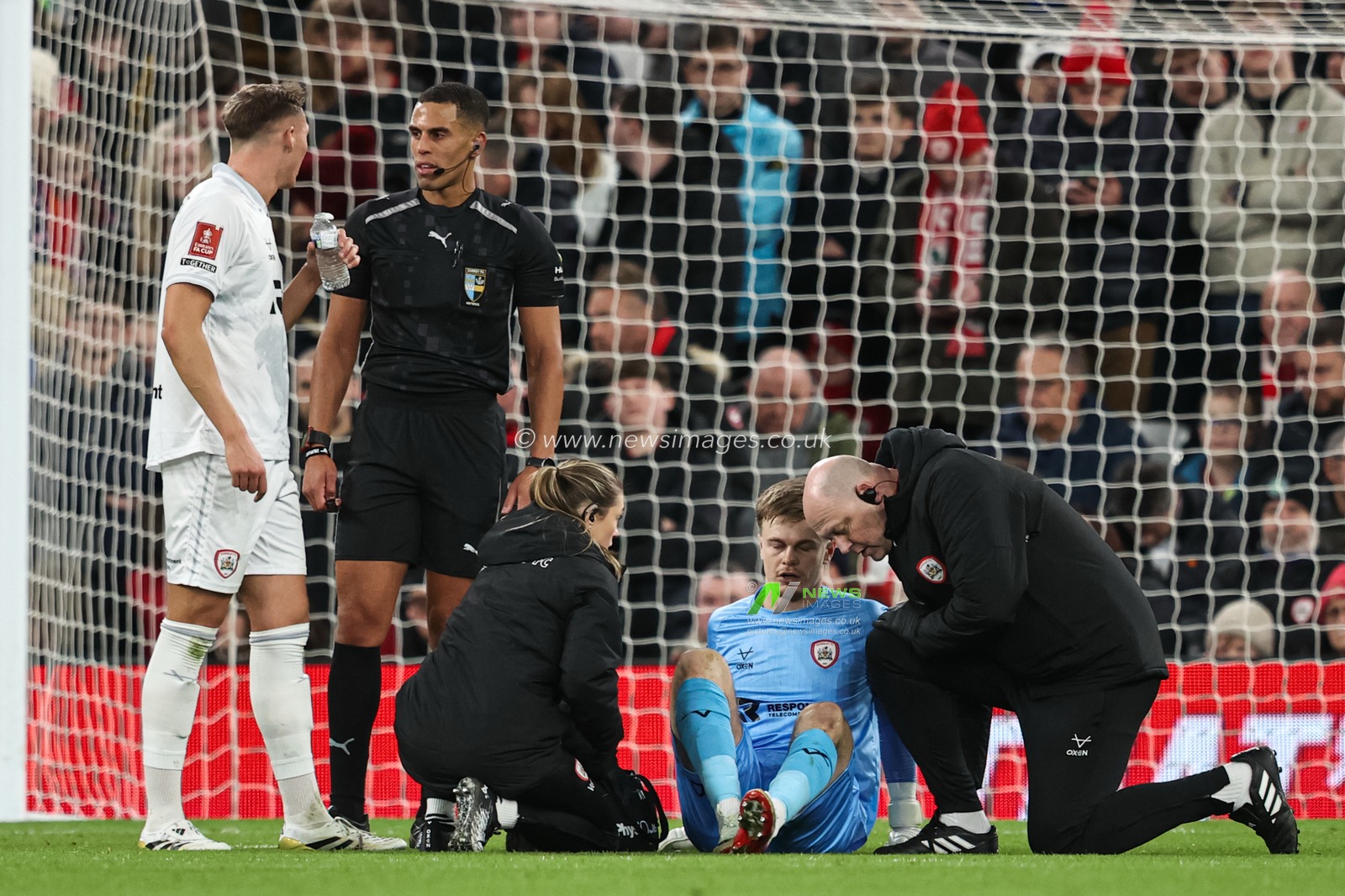 Barnsley goalkeeper Murphy Cooper receives treatment during the Emirates FA Cup Third Round match Liverpool vs Barnsley at Anfield, Liverpool, United Kingdom, 12th January 2026

(Photo by Alfie Cosgrove/News Images)