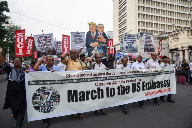 Activists of Social Unity Center of India (SUCI) hold placards and an effigy of US President Donald Trump and Israel's Prime Minister Benjamin Netanyahu during a protest against Western policy in the Israel-Hamas conflict, near US Embassy in Kolkata, Eastern India, 07 October 2025.Photo by Debajyoti Chakraborty.(Photo: Debajyoti Chakraborty/News Images)