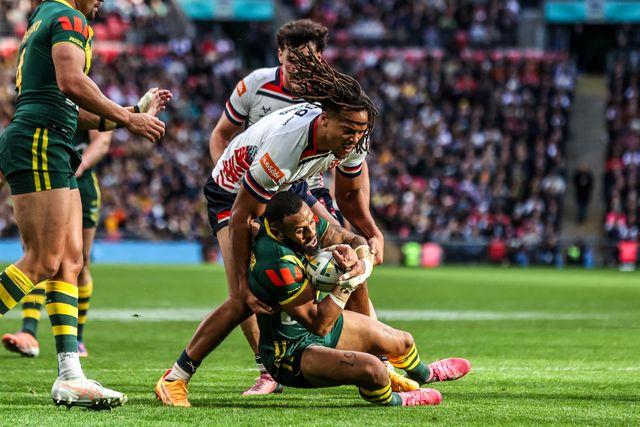 Josh Addo-Carr of Australia is tackled by Dom Young of England  of England during the The Ashes Series 2025 England vs Australia at Wembley Stadium, London, United Kingdom, 25th October 2025

(Photo by Alfie Cosgrove/News Images)