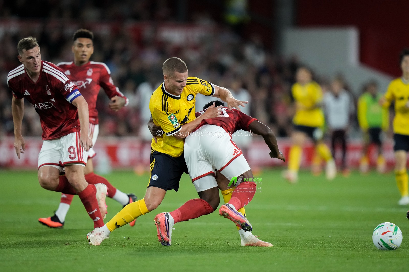 Arnaud Kalimuendo of Nottingham Forest is tackled by  Nico Elvedi of Leeds United during the Carabao Cup round 2 match Nottingham Forest vs Leeds Rhinos at City Ground, Nottingham, United Kingdom on 25 August 2026

(Photo by Maynard Manyowa/News Images)