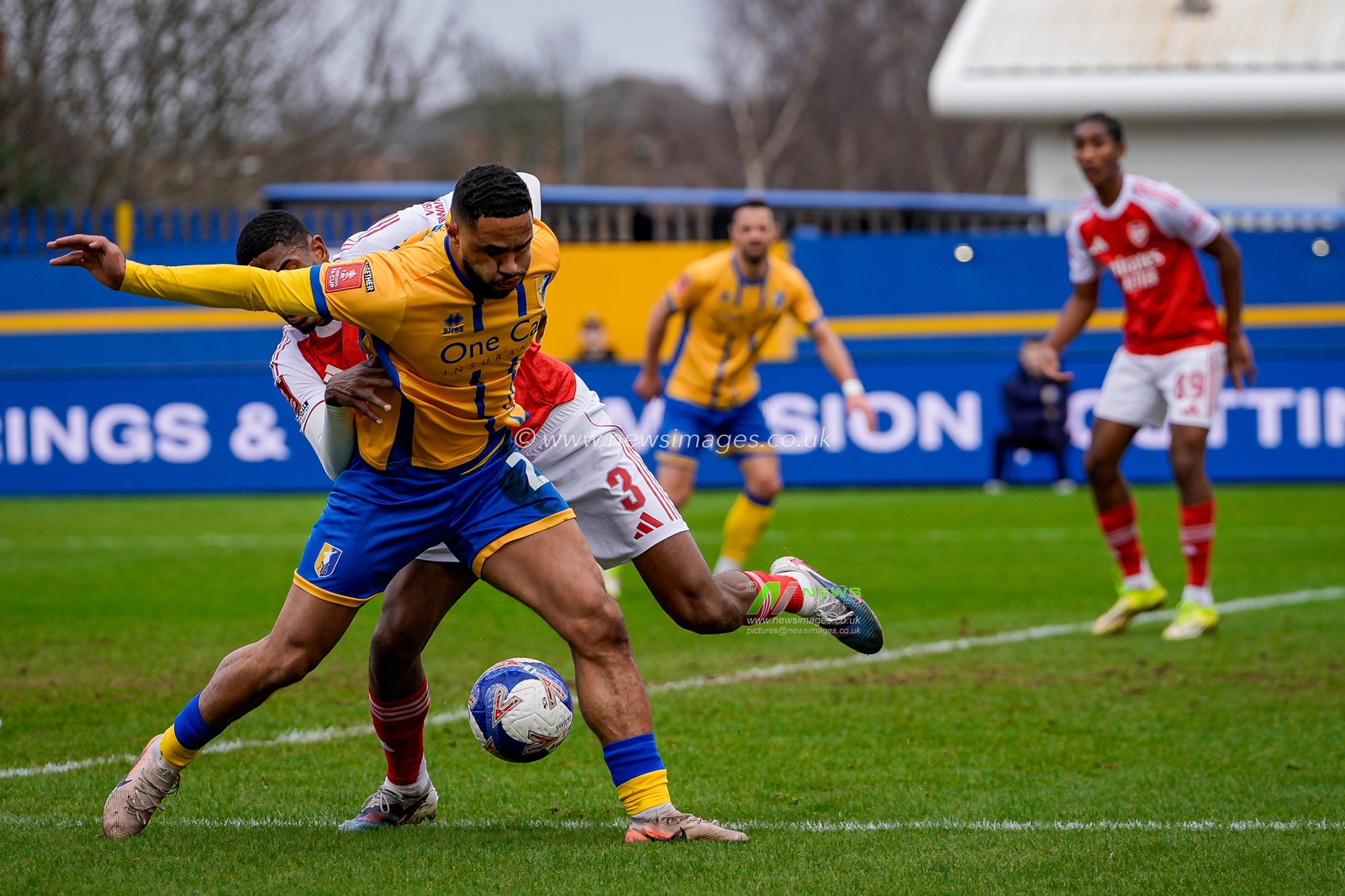 Tyler Roberts of Mansfield Town battles for the ball  with Cristhian Mosquera of Arsenal during the Emirates FA Cup fifth round match Mansfield Town vs Arsenal at One Call Stadium, Mansfield, United Kingdom on 07 March 2026

(Photo by Maynard Manyowa/News Images)