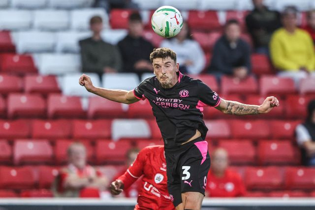 Reece Hutchinson of Crewe Alexandra jumps up to win the high ball during the Carabao Cup round 2 match Barnsley vs Crewe Alexandra at Oakwell, Barnsley, United Kingdom on 25 August 2026

(Photo by Alfie Cosgrove/News Images)