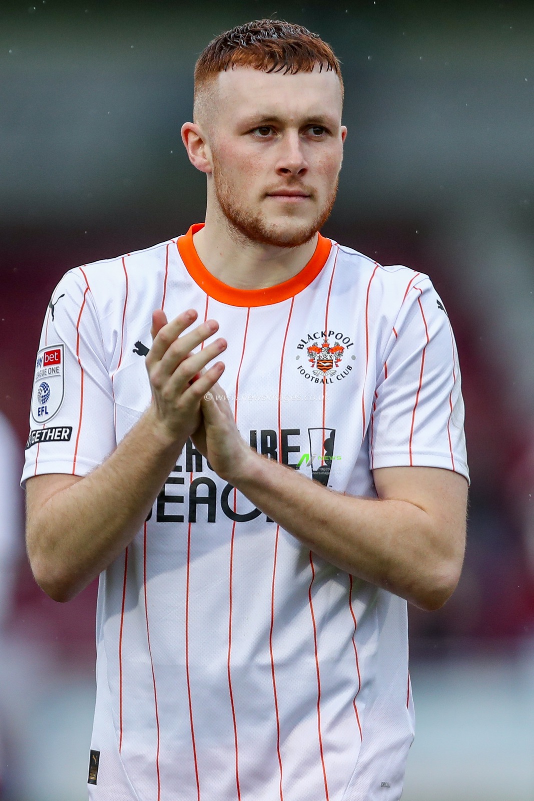 Sonny Carey of Blackpool acknowledges the fans after the teams victory following the Sky Bet League 1 match Northampton Town vs Blackpool at Sixfields Stadium, Northampton, United Kingdom, 22nd March 2025

(Photo by Izzy Poles/News Images)