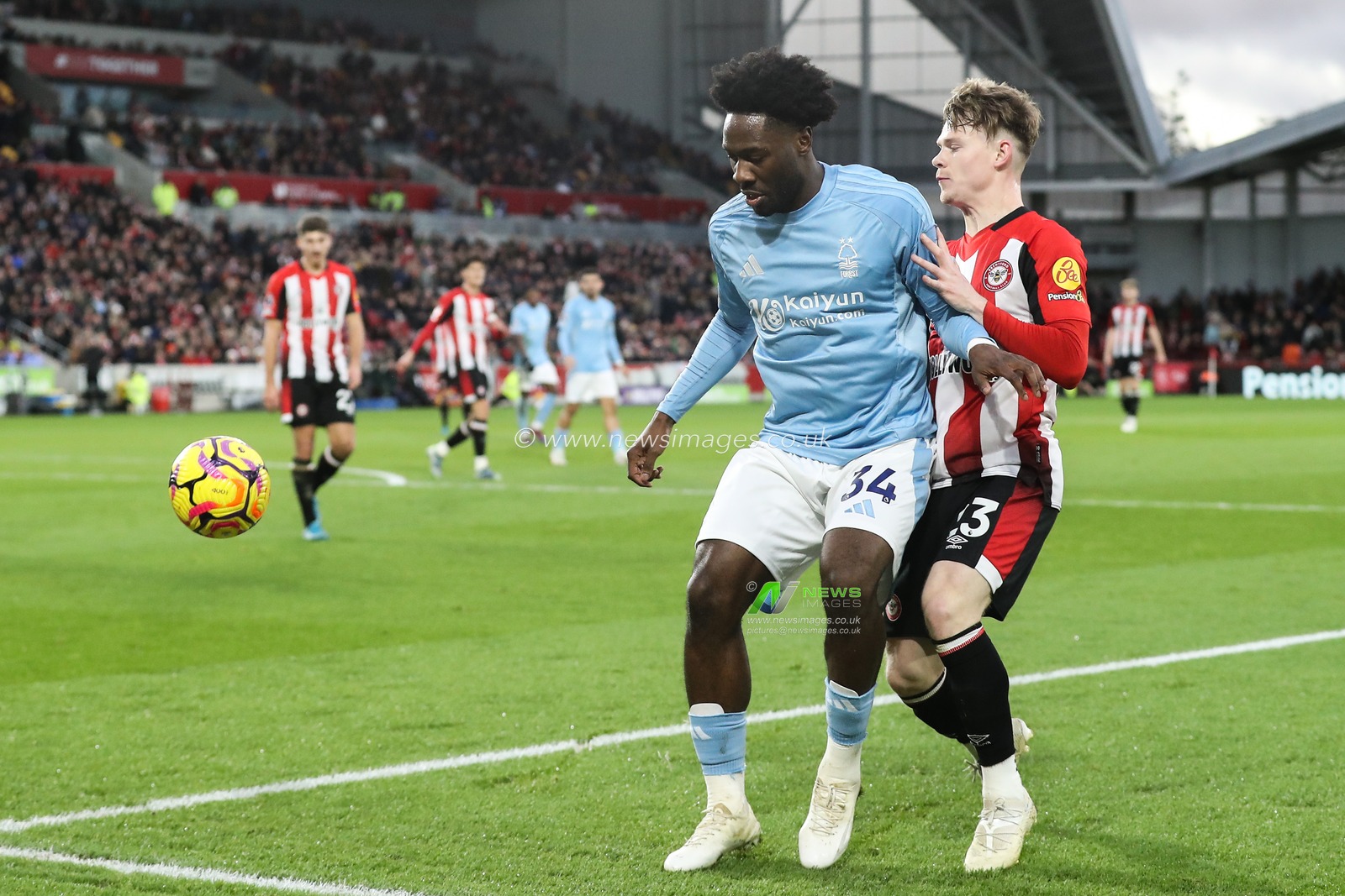 Ola Aina of Nottingham Forest holds off Keane Lewis-Potter of Brentford during the Premier League match Brentford vs Nottingham Forest at The Gtech Community Stadium, London, United Kingdom, 21st December 2024

(Photo by Gareth Evans/News Images)