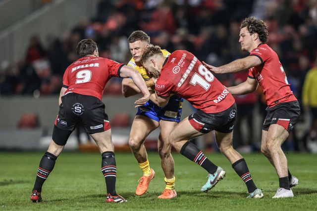 Ash Handley of Leeds Rhinos is tackled by Jack Ormondroyd of Salford Red Devils during the Betfred Super League match Salford Red Devils vs Leeds Rhinos at Salford Community Stadium, Eccles, United Kingdom, 10th April 2025

(Photo by Alfie Cosgrove/News Images)