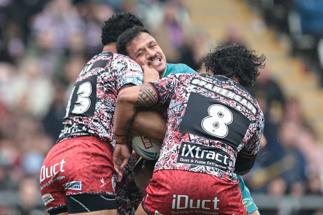 Sauaso Sue of Hull KR is tackled by Isaac Liu of Leigh Leopards and Joe Ofahengaue of Leigh Leopards during the Betfred Super League round 11 match Leigh Leopards vs Hull KR at Leigh Sports Village, Leigh, United Kingdom on 16 May 2026

(Photo by Mark Cosgrove/News Images)