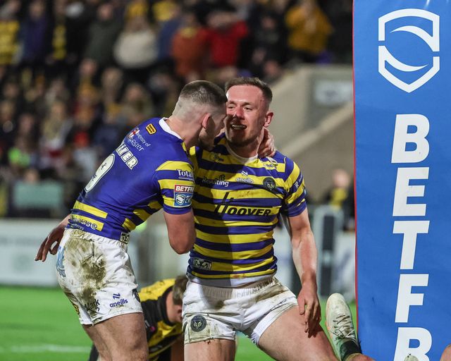 Ben Currie celebrates his 100th Warrington Wolves try with team mates during the Betfred Super League Round 4 match York Knights vs Warrington Wolves at LNER Community Stadium, York, United Kingdom on 06 March 2026

(Photo by Mark Cosgrove/News Images)