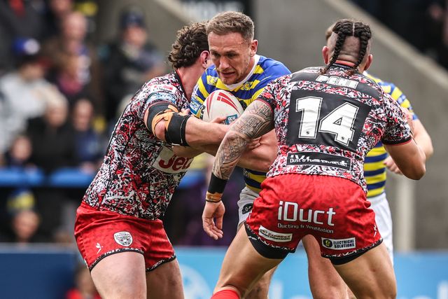 Ben Currie of Warrington Wolves is tackled by Lachlan Lam of Leigh Leopards and Aaron Pene of Leigh Leopards during the Betfred Super League round 7 match Warrington Wolves vs Leigh Leopards at The Halliwell Jones Stadium, Warrington, United Kingdom on 04 April 2026

(Photo by Alfie Cosgrove/News Images)