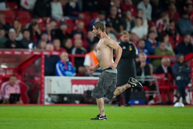 A fan enters the field of play and is tackled and ejected by security during the Carabao Cup round 2 match Nottingham Forest vs Leeds Rhinos at City Ground, Nottingham, United Kingdom on 25 August 2026

(Photo by Maynard Manyowa/News Images)
