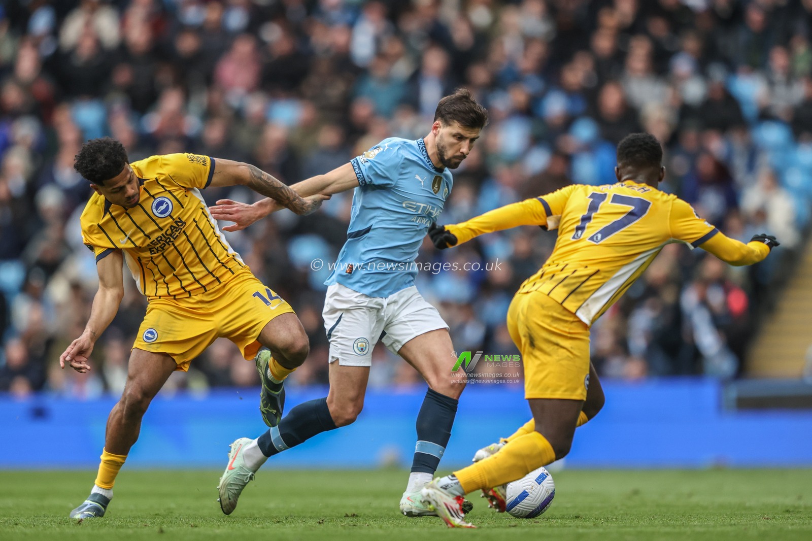 RÃºben Dias of Manchester City breaks past Georginio Rutter of Brighton & Hove Albion and Yankuba Minteh of Brighton & Hove Albion during the Premier League match Manchester City vs Brighton and Hove Albion at Etihad Stadium, Manchester, United Kingdom, 15th March 2025

(Photo by Alfie Cosgrove/News Images)