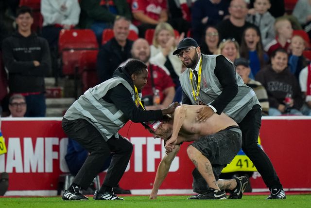 A fan enters the field of play and is tackled and ejected by security during the Carabao Cup round 2 match Nottingham Forest vs Leeds Rhinos at City Ground, Nottingham, United Kingdom on 25 August 2026

(Photo by Maynard Manyowa/News Images)