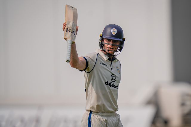Brooke Guest raises his bat to salute the crowd after scoring a hundred and being dismissed during the County Championship Division Two Derbyshire vs Northamptonshire day one match at The Central Co-Op County Ground, Derby, United Kingdom on 09 May 2026

(Photo by Maynard Manyowa/News Images)