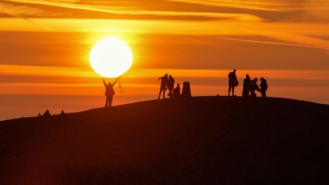 Sunrise hikers walk to the summit of Mam Tor as they watch the sunrise and admire the cloud inversion in the Hope Valley at Mam Tor in the Peak District at Mam Tor, Castleton, United Kingdom on 21 March 2026

(Photo by Mark Cosgrove/News Images)