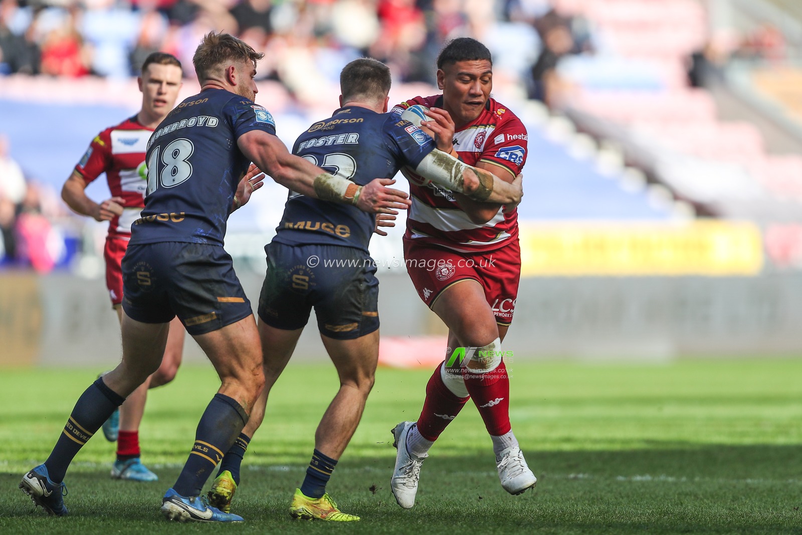 Patrick Mago of Wigan Warriors is tackled during the Betfred Super League Round 6 match Wigan Warriors vs Salford Red Devils at The Brick Community Stadium, Wigan, United Kingdom, 30th March 2025

(Photo by Gareth Evans/News Images)