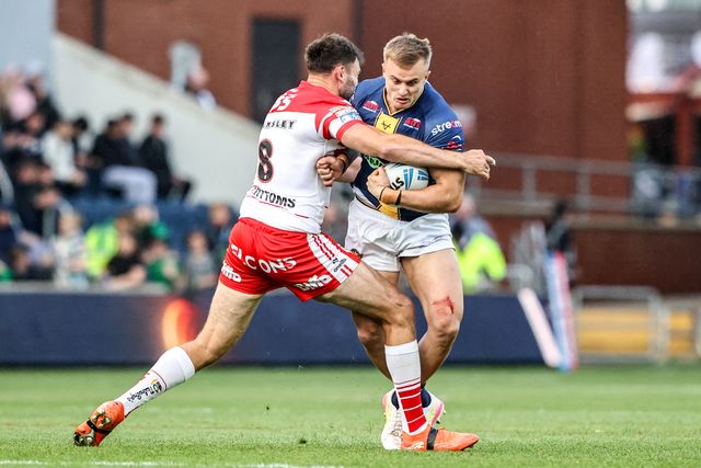 Cooper Jenkins of Leeds Rhinos is tackled by Alex Walmsley of St Helens during the Betfred Super League round 13 match Leeds Rhinos vs St Helens at AMT Headingley Stadium, Leeds, United Kingdom on 04 June 2026

(Photo by Alfie Cosgrove/News Images)