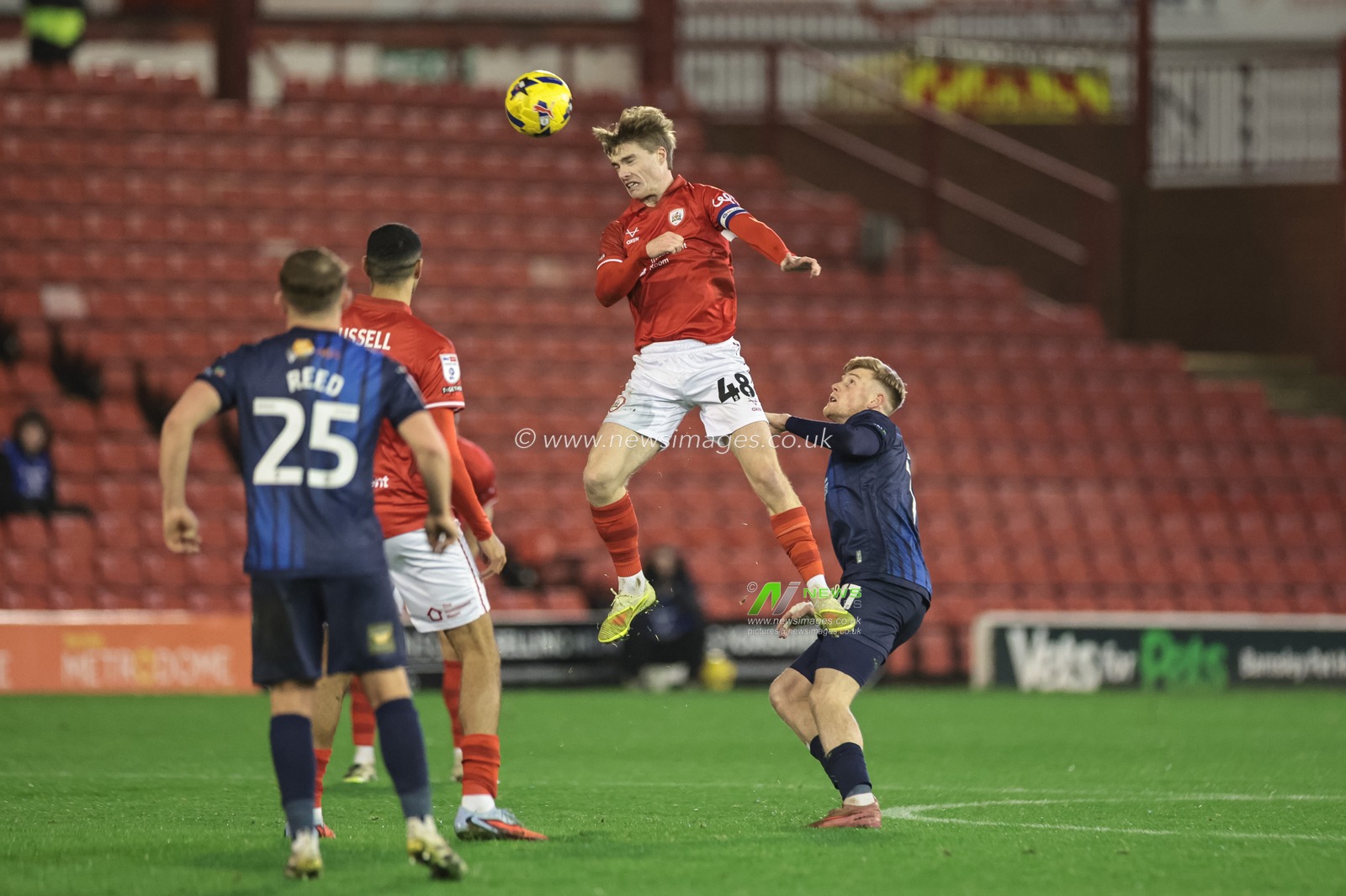 Luca Connell of Barnsley jumps up to win the high ball during the Sky Bet League 1 match Barnsley vs Mansfield Town at Oakwell, Barnsley, United Kingdom, 26th December 2025

(Photo by Mark Cosgrove/News Images)

*** GER AUT SUI OUT ***
