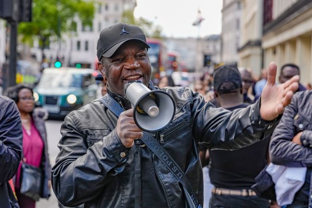 Shepherd Yuda address protesters UK-based Zimbabweans gather outside the Zimbabwe Embassy in London on 18 April 2026 to protest the Constitution of Zimbabwe Amendment (No. 3) Bill, which critics say would extend President Mnangagwa’s rule until 2030 and strip citizens of the direct vote for president.

(Photo by Maynard Manyowa/News Images)
