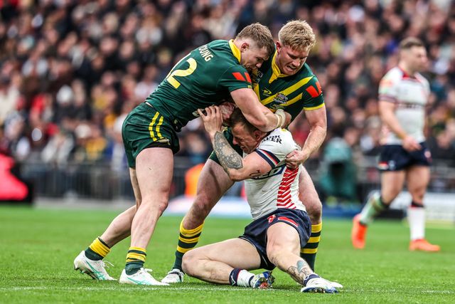 Tom Johnstone of England is tackled by Hudson Young of Australia and Tom Dearden of Australia during the The Ashes Series 2025 England vs Australia at Wembley Stadium, London, United Kingdom, 25th October 2025

(Photo by Alfie Cosgrove/News Images)