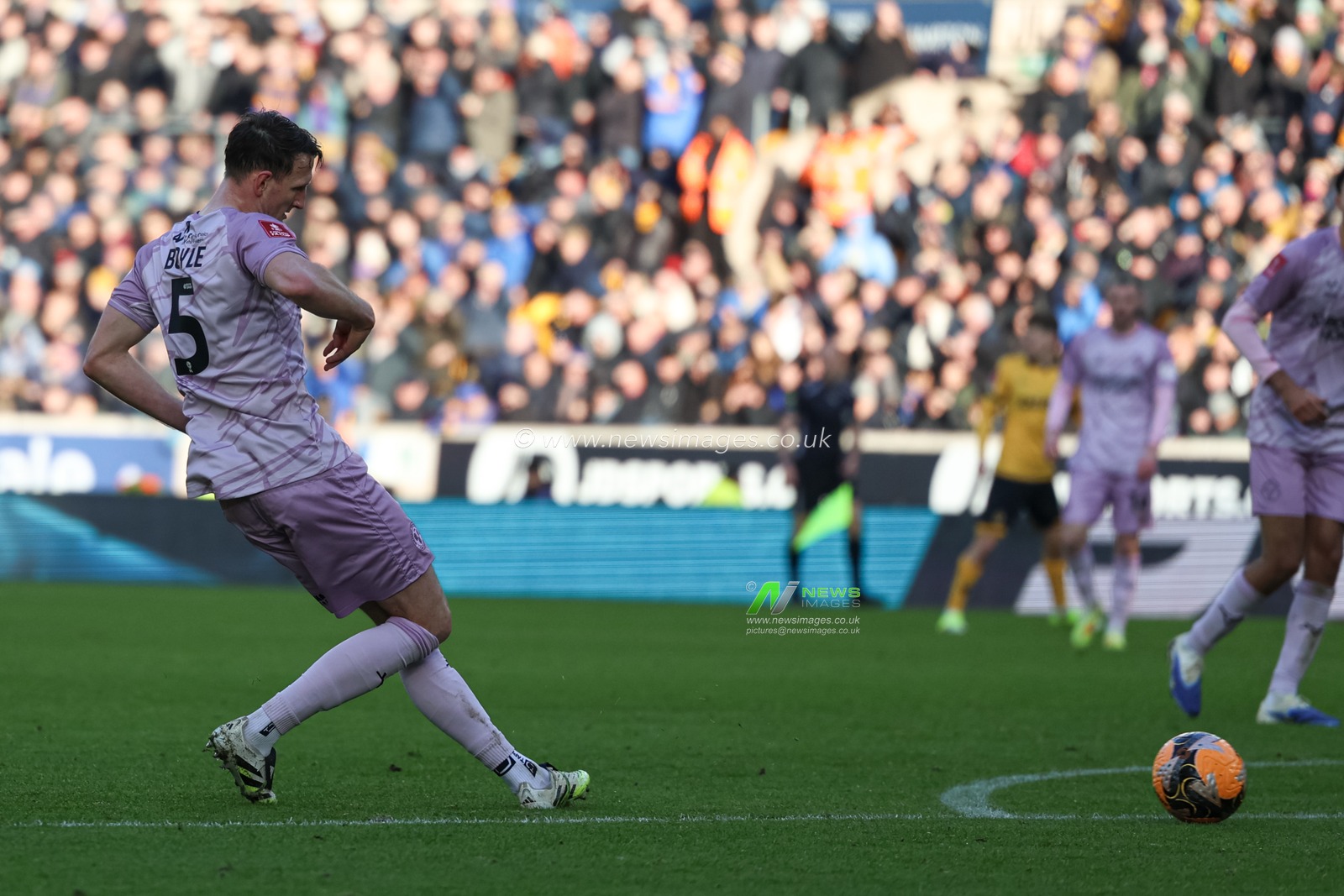 William Boyle of Shrewsbury Town passes the ball during the Emirates FA Cup Third Round match Wolverhampton Wanderers vs Shrewsbury Town at Molineux, Wolverhampton, United Kingdom, 10th January 2026

(Photo by Euan Manning/News Images)