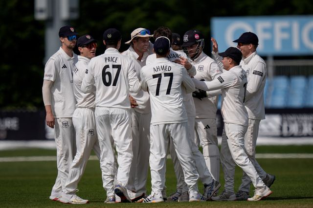 Ed Middleton celebrates taking the wicket of Wayne Madsen off the bowling of Will Williams with his teammates during the County Championship Division Two Derbyshire v Gloucestershire at The Central Co-Op County Ground, Derby, United Kingdom on 26 April 2026

(Photo by Maynard Manyowa/News Images)
