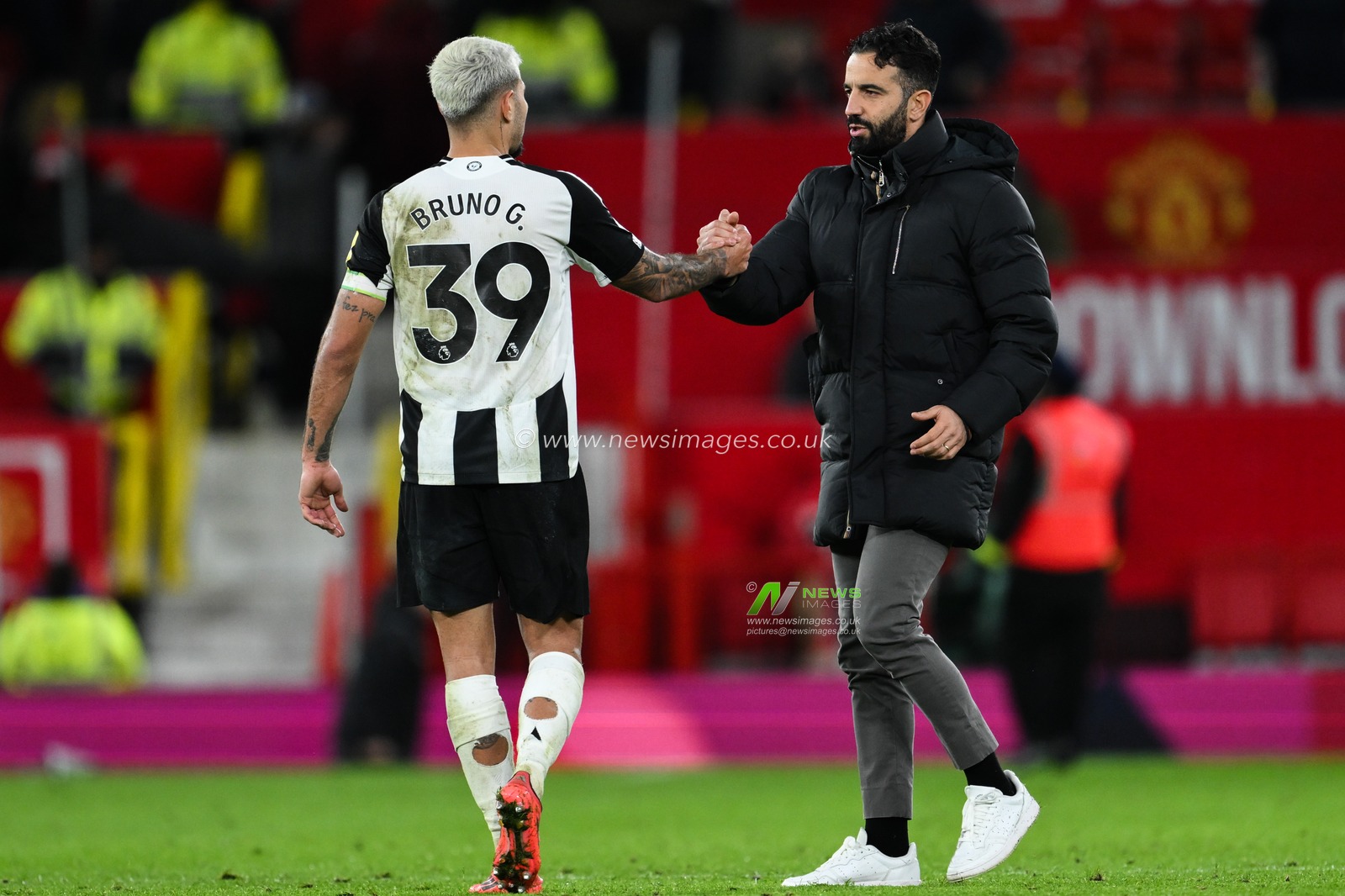 Bruno GuimarÃ£es of Newcastle United and Ruben Amorim Manager of Manchester United embrace after the Premier League match Manchester United vs Newcastle United at Old Trafford, Manchester, United Kingdom, 30th December 2024

(Photo by Craig Thomas/News Images)