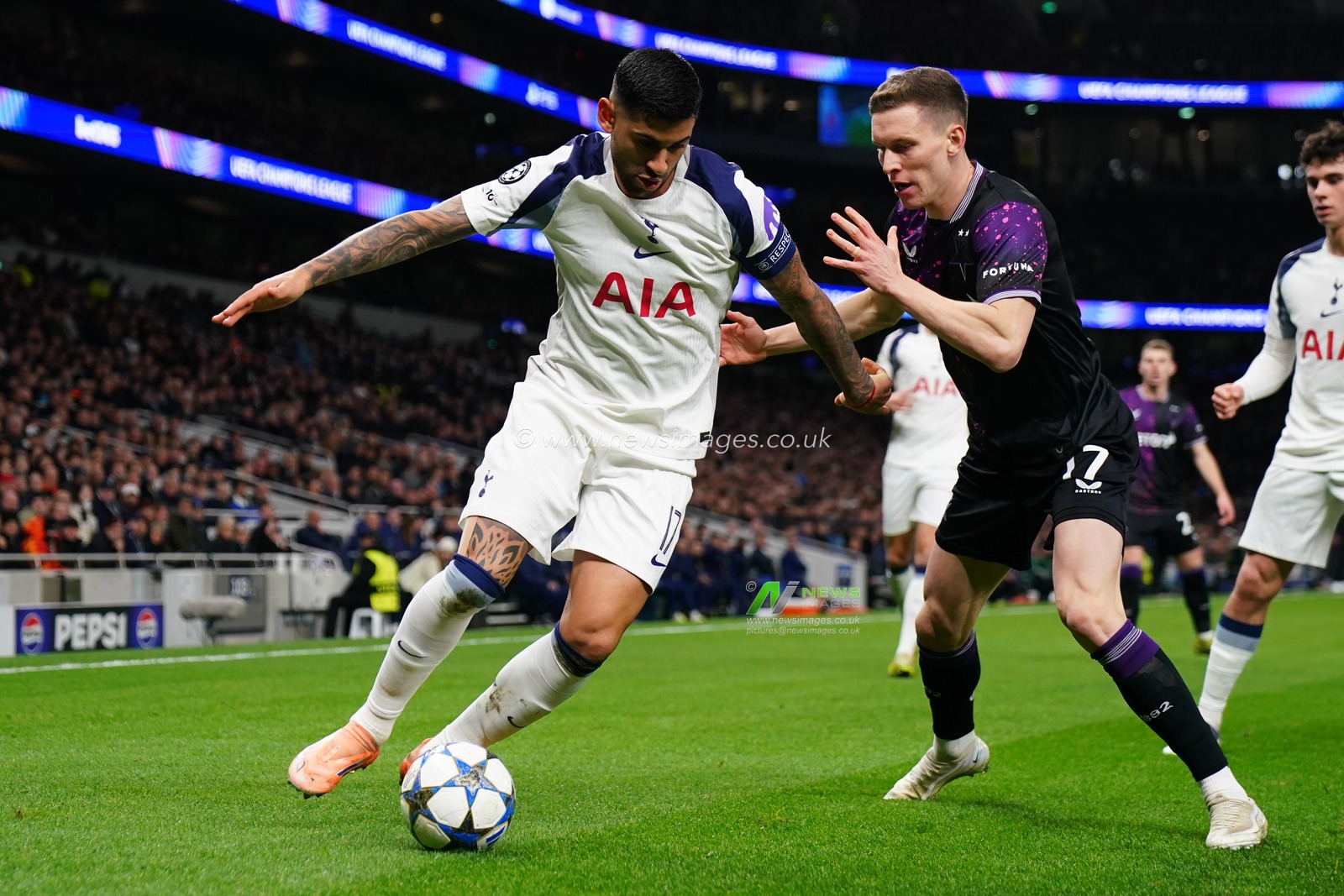 Cristian Romero of Tottenham Hotspur on the ball under pressure from Lukas Provod of Slavia Prague during the UEFA Champions League Matchday 6 of 8 Tottenham Hotspur vs Slavia Prague at Tottenham Hotspur Stadium, London, United Kingdom, 9th December 2025

(Photo by Harvey Murphy/News Images)

*** GER AUT SUI OUT ***
