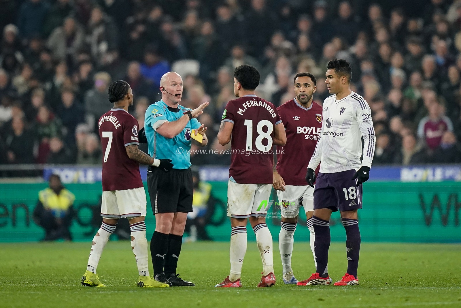 Referee Simon Hooperv gives a yellow card to  Mateus Fernandes of West Ham United during the Premier League match West Ham United vs Manchester United at London Stadium, London, United Kingdom on 10 February 2026

(Photo by Maynard Manyowa/News Images)