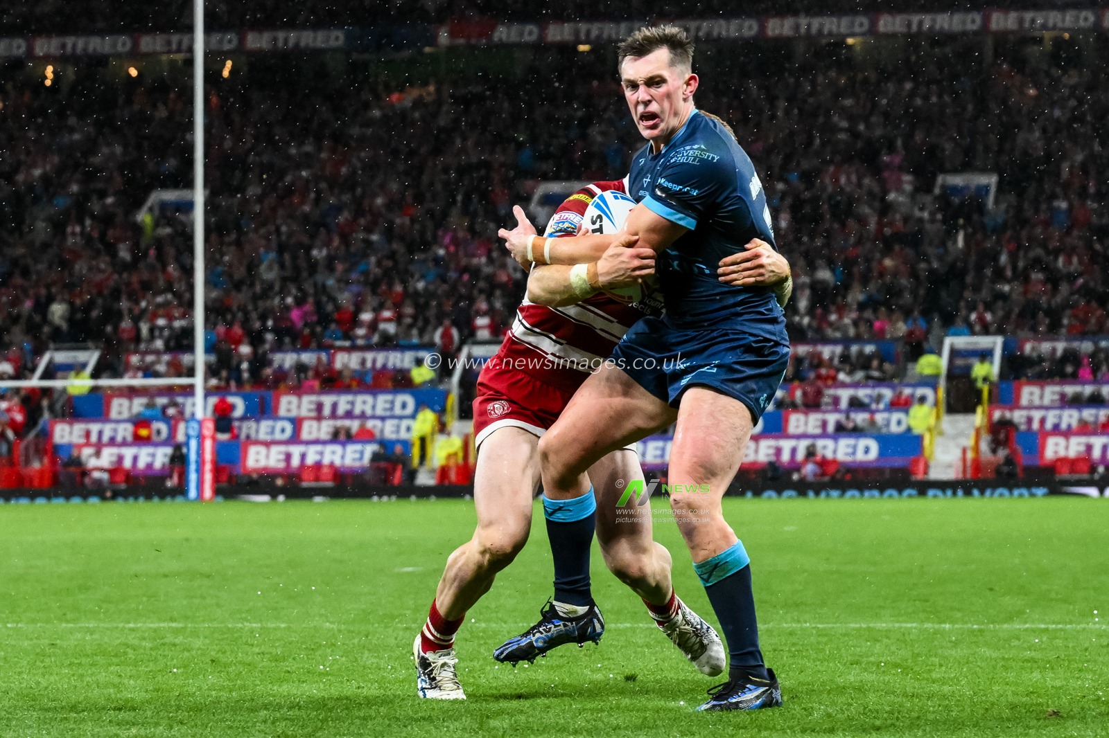 Jack Broadbent of Hull KR is tackled short of the line by Adam Keighran of Wigan Warriors during the Betfred Super League Grand Final match Wigan Warriors vs Hull KR at Old Trafford, Manchester, United Kingdom, 12th October 2024

(Photo by Craig Thomas/News Images)