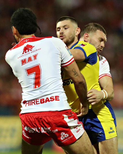 Tyrone May of Hull KR tackles Danny Walker of Warrington Wolves during the Betfred Super League round 27 match Hull KR vs Warrington Wolves at Sewell Group Craven Park, Kingston upon Hull, United Kingdom, 18th September 2025(Photo by Sam Eaden/News Images)