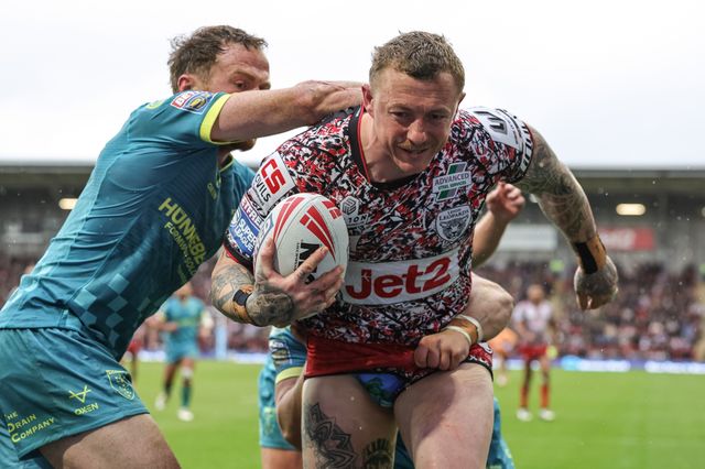 Josh Charnley of Leigh Leopards is pushed out of play in his defence line by Joe Burgess of Hull KR and Mikey Lewis of Hull KR during the Betfred Super League round 11 match Leigh Leopards vs Hull KR at Leigh Sports Village, Leigh, United Kingdom on 16 May 2026

(Photo by Mark Cosgrove/News Images)