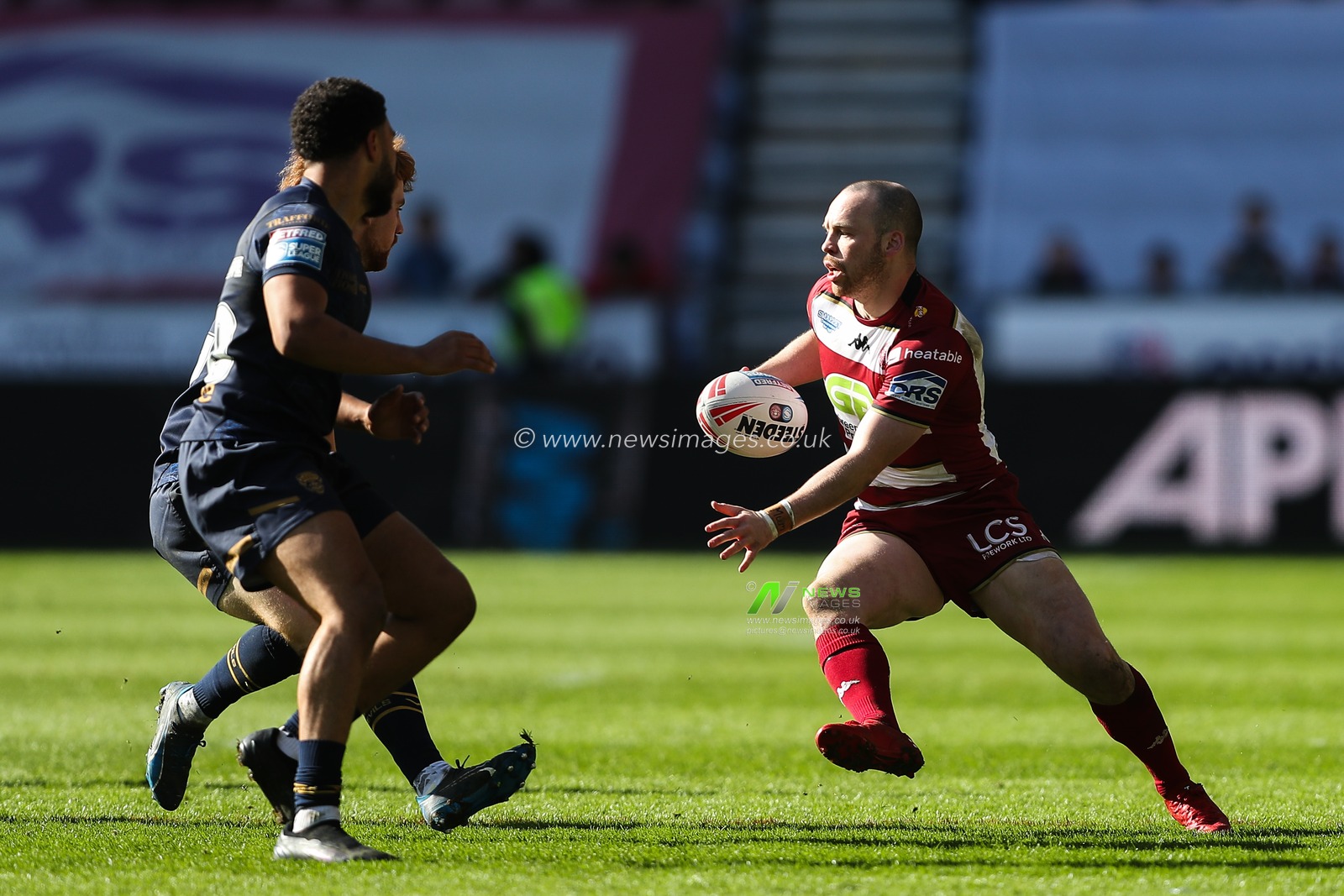 Liam Marshall of Wigan Warriors runs with the ball during the Betfred Super League Round 6 match Wigan Warriors vs Salford Red Devils at The Brick Community Stadium, Wigan, United Kingdom, 30th March 2025

(Photo by Gareth Evans/News Images)