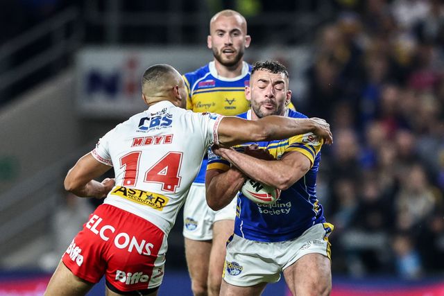 Moses Mbye of St. Helens pulls Jake Connor of Leeds Rhinos to the floor conceding a penalty during the Betfred Super League play-off Eliminator 1 match Leeds Rhinos vs St Helens at Headingley Stadium, Leeds, United Kingdom, 27th September 2025

(Photo by Alfie Cosgrove/News Images)