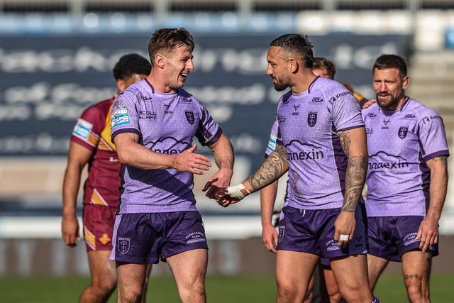 Tom Davies of Hull KR and Elliot Minchella of Hull KR celebrate after the game during the Betfred Super League Round 6 match Huddersfield Giants vs Hull KR at John Smith's Stadium, Huddersfield, United Kingdom, 30th March 2025

(Photo by Alfie Cosgrove/News Images)