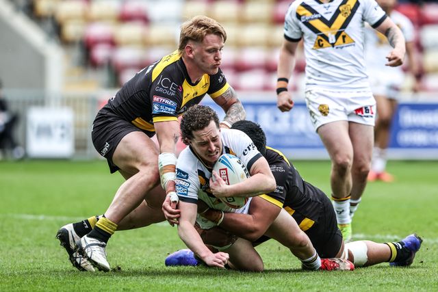 Tom Weaver of Castleford Tigers is tackled by Jack Martin of York Knights and Xavier Va'a of York Knights during the Betfred Super League round 12 match York Knights vs Castleford Tigers at LNER Community Stadium, York, United Kingdom on 16 May 2026

(Photo by Alfie Cosgrove/News Images)