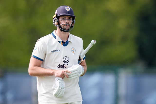 Ben Aitchison walks off after being caught by Cameron Bancroft off the bowling of Craig Miles as Gloucestershire players celebrate a wicket during the County Championship Division Two Derbyshire v Gloucestershire at The Central Co-Op County Ground, Derby, United Kingdom on 26 April 2026

(Photo by Maynard Manyowa/News Images)