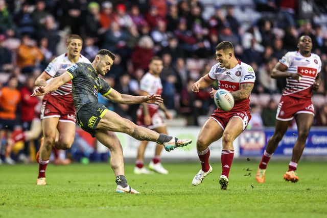 Jake Connor of Leeds Rhinos kicks the ball up field during the Betfred Super League round 11 match Wigan Warriors vs Leeds Rhinos at The Brick Community Stadium, Wigan, United Kingdom on 15 May 2026

(Photo by Alfie Cosgrove/News Images)