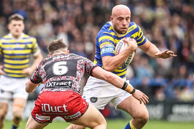 James Harrison of Warrington Wolves is tackled by Adam Cook of Leigh Leopards during the Betfred Super League round 7 match Warrington Wolves vs Leigh Leopards at The Halliwell Jones Stadium, Warrington, United Kingdom on 04 April 2026

(Photo by Alfie Cosgrove/News Images)