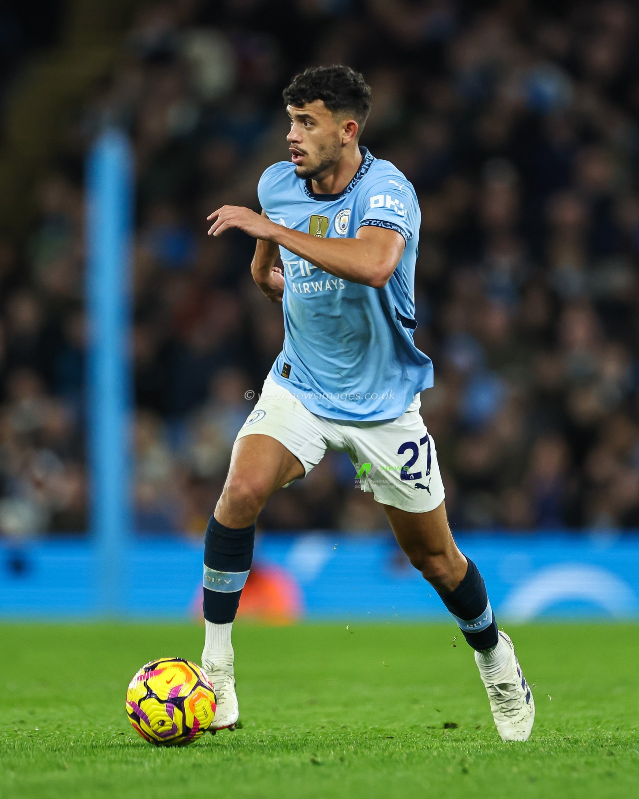 Matheus Nunes of Manchester City makes a break with the ball  during the Premier League match Manchester City vs Manchester United at Etihad Stadium, Manchester, United Kingdom, 15th December 2024

(Photo by Mark Cosgrove/News Images)