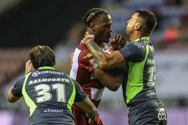 Junior Nsemba of Wigan Warriors is tackled during the Betfred Super League round 20 match Wigan Warriors vs Catalans Dragons at The Brick Community Stadium, Wigan, United Kingdom, 25th July 2025

(Photo by Alfie Cosgrove/News Images)