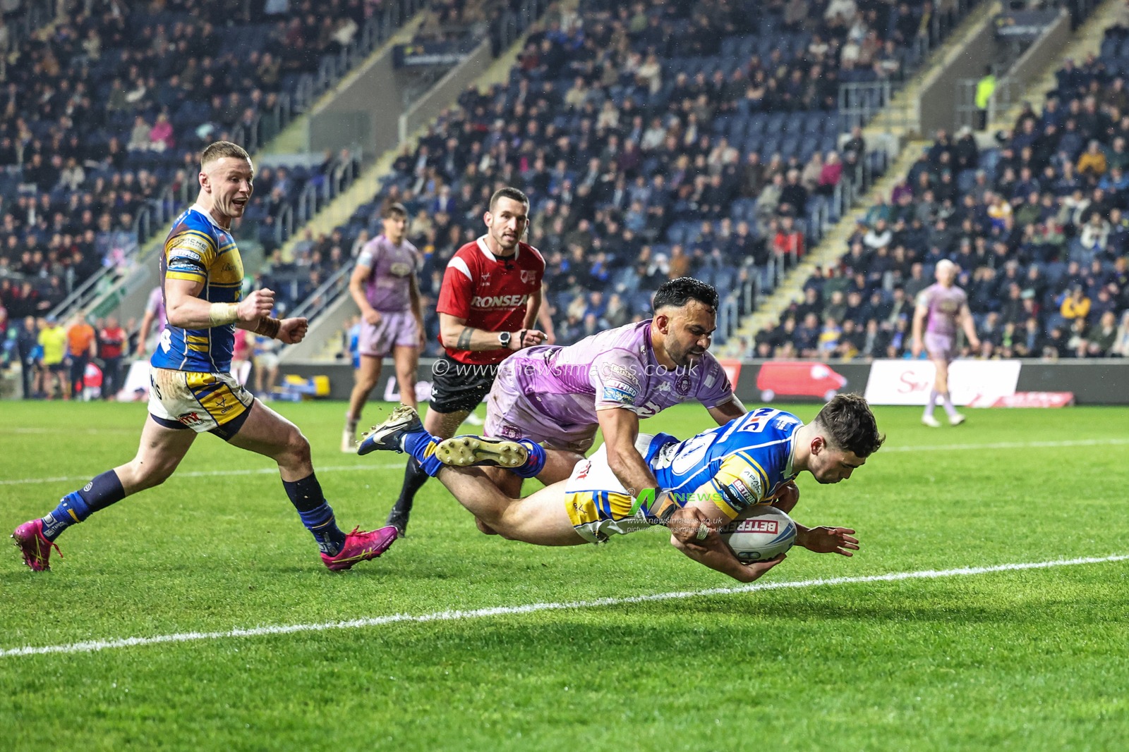 Jack Sinfield of Leeds Rhinos goes over for a try and makes the score 10-10 during the Betfred Super League Round 5 match Leeds Rhinos vs Wigan Warriors at Headingley Stadium, Leeds, United Kingdom, 22nd March 2025

(Photo by Mark Cosgrove/News Images)